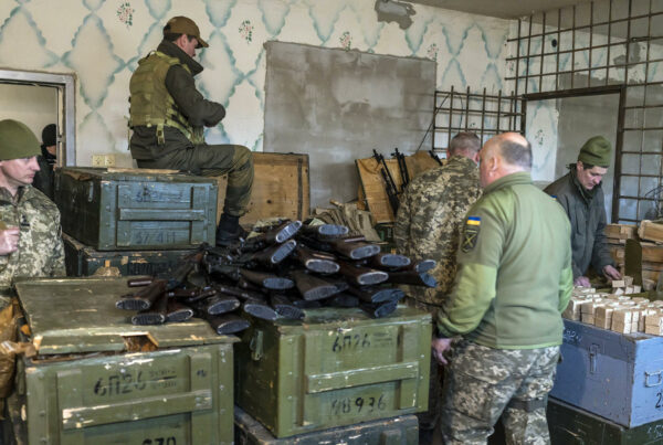 Military volunteers load magazines with ammunition on Feb. 25, 2022, at a weapons storage facility in Fastiv, Ukraine. (Brendan Hoffman/The New York Times)