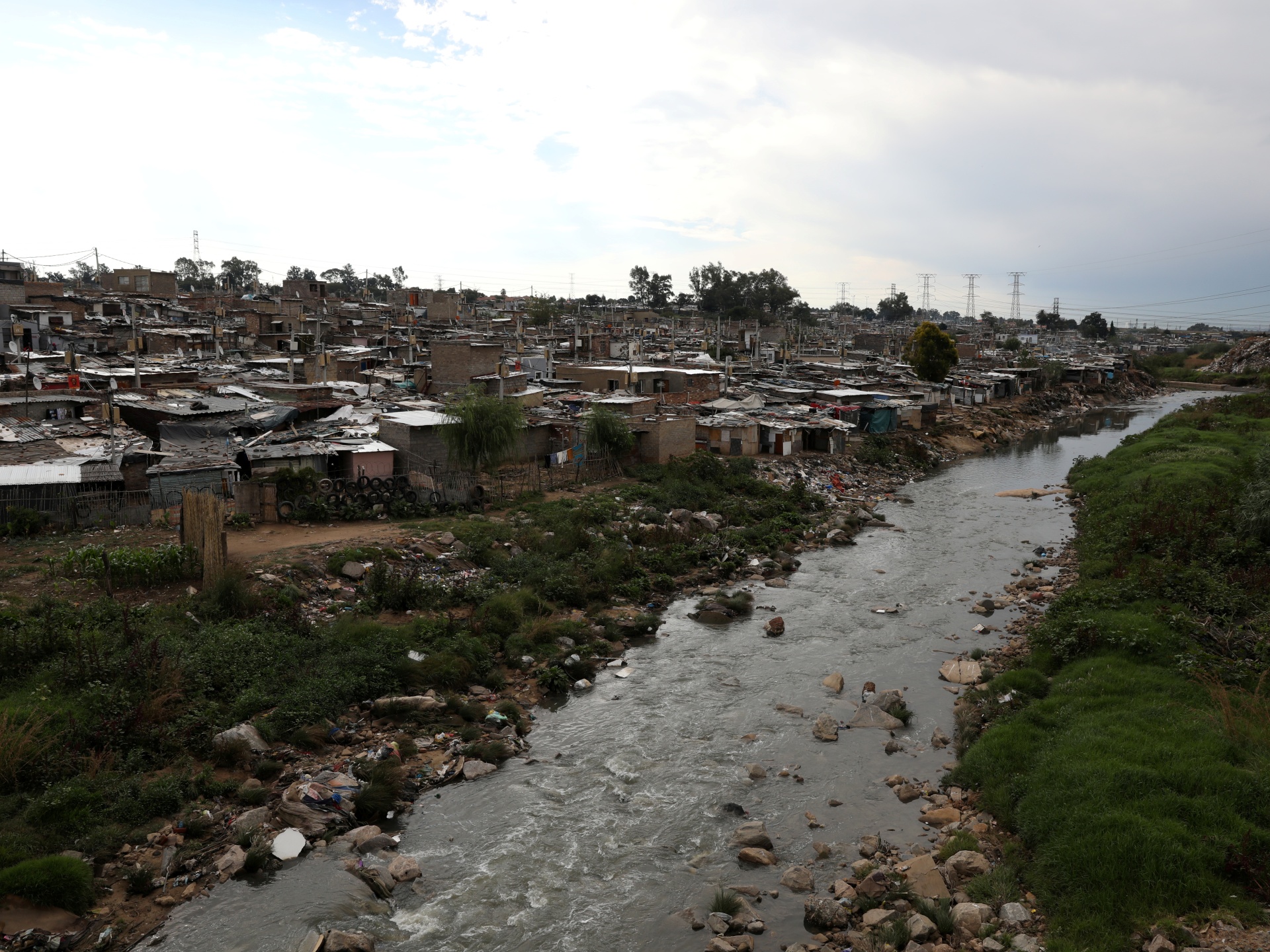 14 dead, more missing after worshipers holding baptisms in a river are swept away by a flash flood