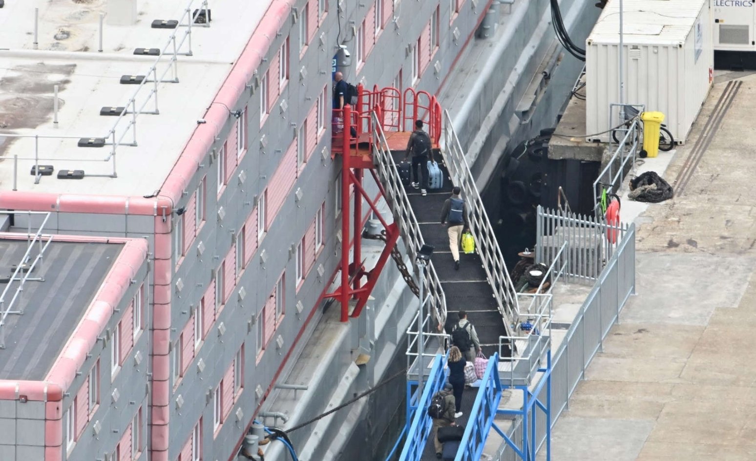 First Group of Migrants Seeking Asylum Moved onto Barge in the UK