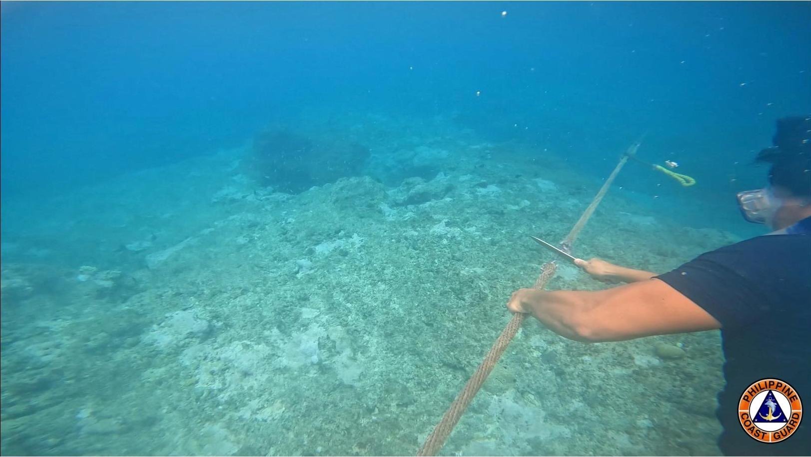 Philippine Coastguard Dismantles Chinese Barrier in South China Sea