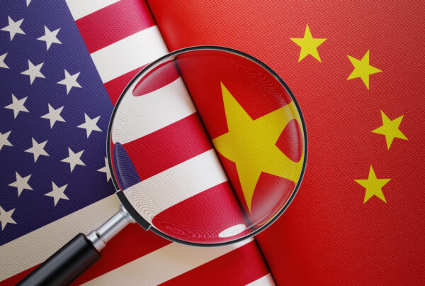 American And Chinese Flag Pair Under A Magnifier