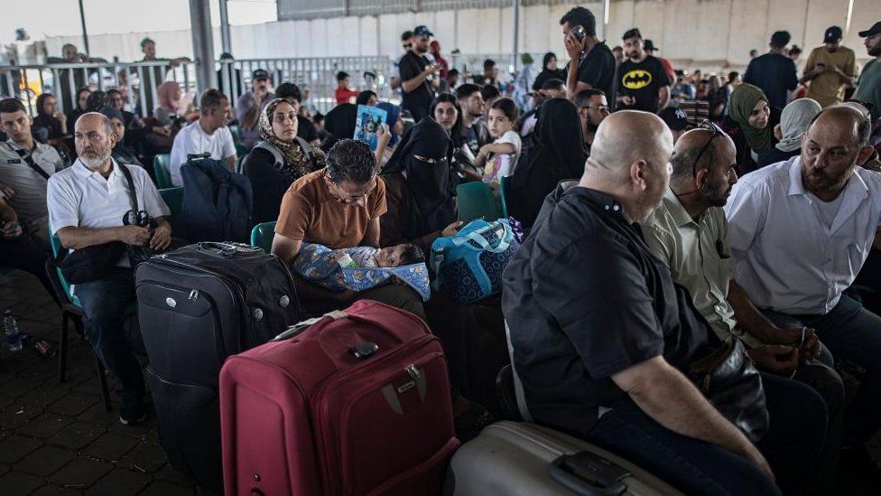 Evacuations at Rafah Crossing Halted After Ambulance Strike
