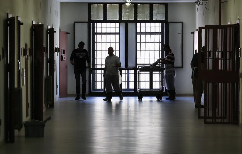 A Prisoner Walks In A Corridor Of The Historic Regina Coeli Or Queen Of Heaven Jail In Rome